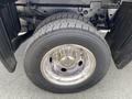 Close-up of a 2010 Ford F-550 tire showcasing a chrome rim and tread pattern