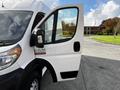 A 2019 RAM Promaster van with its driver's side door open showcasing the interior and dashboard area