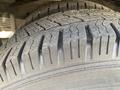 Close-up view of a tire tread on a Chevrolet Express showcasing the detailed grooves and patterns of the tire surface