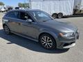 A 2016 Audi A3 in gray with a sporty design featuring sleek lines and alloy wheels parked at a location with clear visibility of the front and side of the car