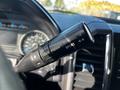 Close-up of the gear shift lever in a 2017 Ford F-150 with markings for tow/haul and sport modes