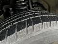 Close-up of a tire tread on a 2011 Ford F-250 SD showing detailed grooves and surface texture