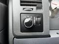 Control panel of a 2008 Dodge Ram 5500 featuring a knob for adjusting lights and other functions