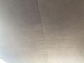 Image shows the ceiling interior of a 1966 Ford Mustang with a textured material in a light color