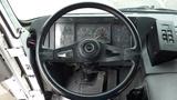 View of the steering wheel and dashboard of a 2007 Autocar WXLL showing gauges and controls