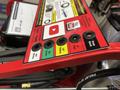 A close-up view of the control panel on a 2024 Magnum 4000 Hot Water Pressure Washer featuring various spray nozzle options and a red and black design