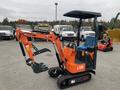 A 2024 AGT L12R compact excavator with an orange and black color scheme features a digging arm and bucket attachment