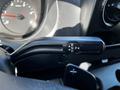 A close-up view of the gear shift lever in a 2021 Mercedes-Benz Sprinter showing the P R N D options