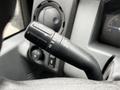 Close-up of a 2011 Ford F-250 SD windshield wiper control lever with various settings indicated on its surface
