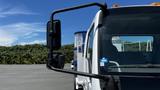 A 2006 Ford LCF 550 truck featuring a large side mirror and a clear windshield positioned at the front of the vehicle