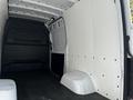 Interior view of a 2022 Mercedes-Benz Sprinter van showing a spacious cargo area with white walls and a black floor