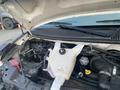 2017 Chevrolet Express engine compartment showcasing the engine components and coolant reservoir