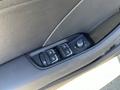 Close-up of the door control panel of a 2016 Audi A3 featuring window switches and a locking mechanism