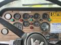 Dashboard of a 1991 Western Star 3800 featuring various gauges buttons and a steering wheel with a logo