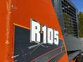 Orange and gray Gehl R105 skid steer loader with the model number prominently displayed on its side