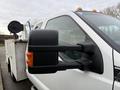 A 2013 Ford F-350 SD with a prominent side mirror and orange cab lights on the roof