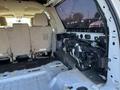 Interior view of a 2013 Ford Expedition showing the rear seating area and exposed components on the passenger side