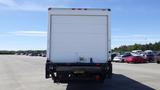 A 2009 Hino 268 box truck seen from the rear with a plain white cargo area and a visible license plate mounted at the back