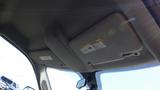 The image shows the sun visors and interior overhead of a 2014 RAM 3500 with label stickers attached to the visors