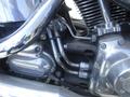 Close-up of a 2009 Harley-Davidson FLSTC engine showcasing chrome components and intricate pipework