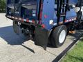 A blue 2007 International 7300 truck with a large rear compartment and dual rear wheels