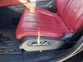 Red leather seat of a 2023 Acura MDX with seat adjustment controls on the side