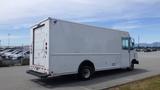 A white 2011 Ford Econoline delivery truck is parked with a plain rear and no visible branding on its sides