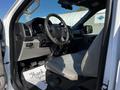Interior view of a 2017 Ford F-150 showing the driver's side with steering wheel and front seat visible