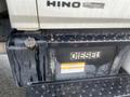 A 2008 Hino 268 truck with a diesel fuel tank visible showing the word "DIESEL" and a caution label on its side
