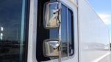 Close-up of side mirrors on a white 2011 Ford Econoline van