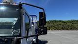 A 2006 Ford LCF 550 featuring a side mirror and a view of the driver's seat inside the cab