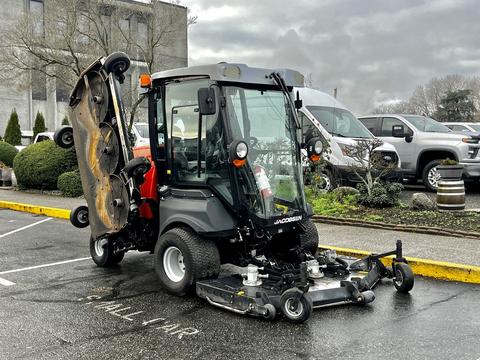 A 2020 Jacobsen HR800 turf maintenance vehicle features a compact design with two mowing decks at the front and a cabin with large windows for visibility and operation