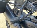 Detail view of a 2021 Harley-Davidson RA1250 S footpeg assembly featuring a metal bracket and black rubber footrest