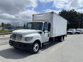 A 2014 International TerraStar box truck in white with a cargo area, featuring side mirrors and front headlights