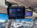 A display screen showing images from cameras mounted on a 2007 Ford Econoline van