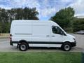 A white 2017 Mercedes-Benz Sprinter van parked with a high roof and sliding side door