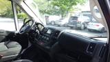 Interior view of a 2017 RAM Promaster with a dashboard featuring control buttons and a steering wheel