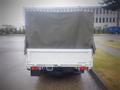 A 2003 Toyota Toyoace with a covered cargo bed is shown from the rear