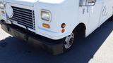 A white 2006 Ford Econoline with a flat front and a prominent grille featuring horizontal slats and orange turn signal lights