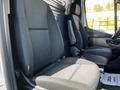 Two upholstered front seats of a 2022 Mercedes-Benz Sprinter interior with a simple design and black fabric upholstery