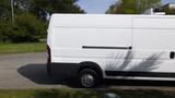 A white 2017 RAM Promaster van with a long body and a single sliding door on the side