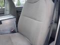 A gray fabric seat of a 2009 Ford F-450 SD with a clean design and no visible stains or damage