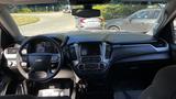 Interior view of a 2018 Chevrolet Tahoe showcasing the steering wheel dashboard and center console with touch screen and controls