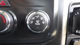 Control dial for HVAC settings in a 2014 RAM 5500 featuring a push button for adjusting air flow direction