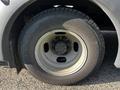 A close-up of a tire and wheel assembly from a 2015 Chevrolet Express showing the tire tread and metal rim