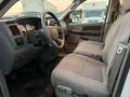 Interior view of a 2008 Dodge Ram 5500 showing front seats and dashboard with controls and gauges visible