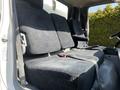Interior seats of a 2020 Hino 195 featuring three grey upholstered seats with seat belts and a simple design