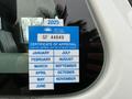 A blue British Columbia vehicle certificate of approval sticker displaying the year 2025 and various months with an expiration note