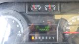 Dashboard of a 2011 Ford Econoline showing speedometer fuel gauge and odometer with readings of 0 RPM and 15943.0 kilometers