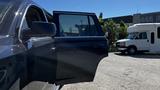 A 2018 Chevrolet Tahoe with the driver's door open positioned at an angle